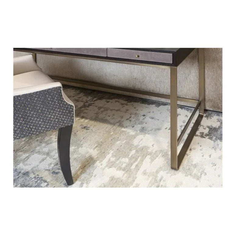 Modern area rug with neutral tones under metal frame console table and patterned chair