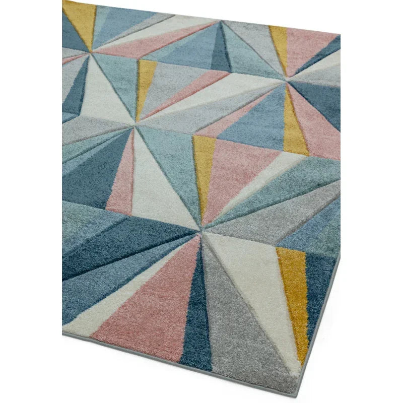 Geometric area rug with multicolour triangles in blue, yellow, pink and grey tones