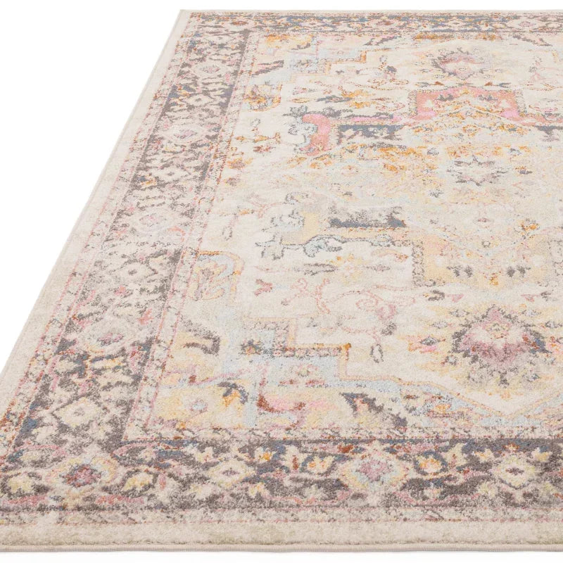Muted multicolor patterned area rug with ornate border and distressed vintage design