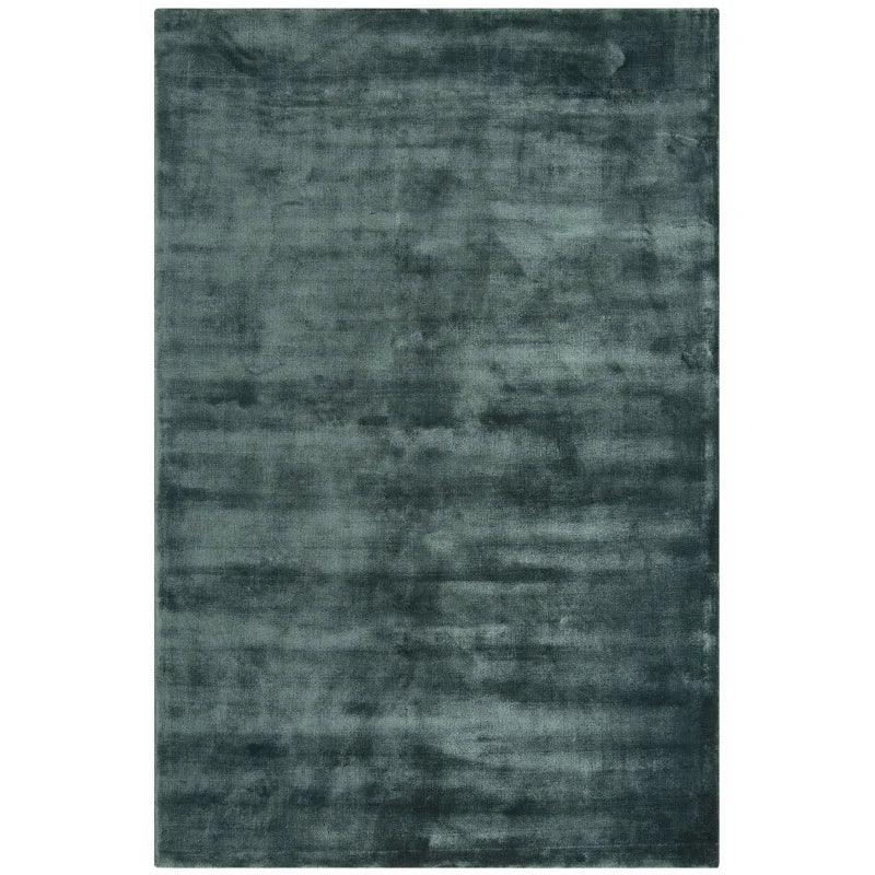 Charcoal grey area rug with soft texture and subtle pattern