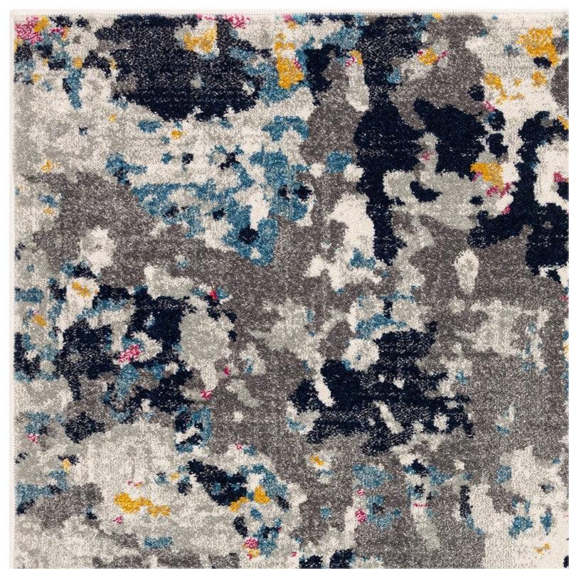Abstract area rug with grey, blue, yellow, and pink splashes in modern pattern