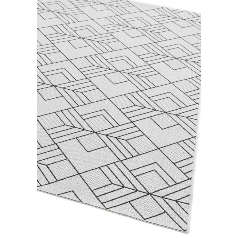 Geometric patterned area rug with black lines on a light background, corner angled view