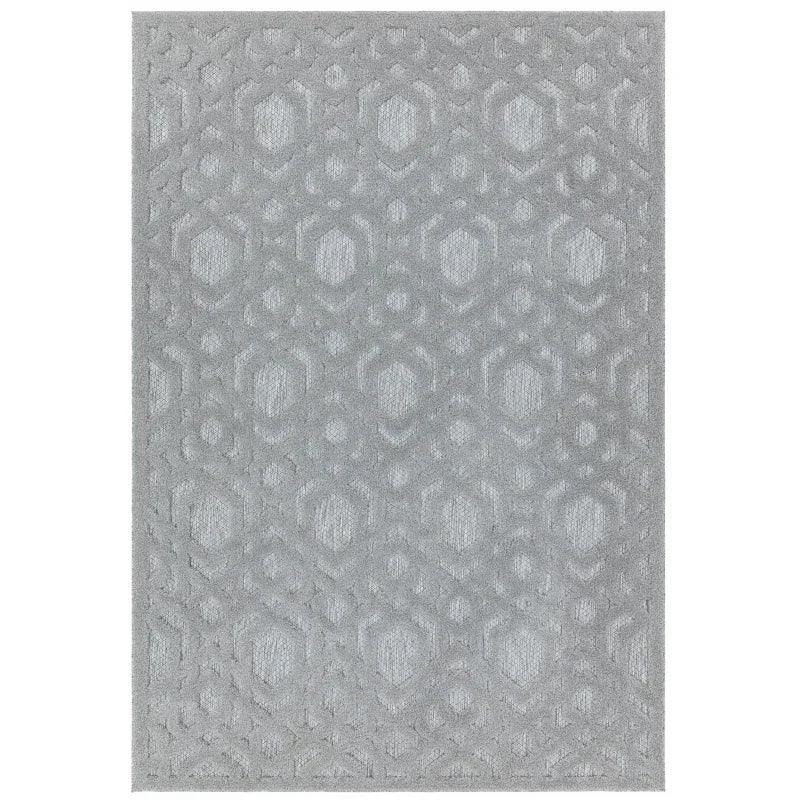 Light grey geometric pattern area rug with raised textured design