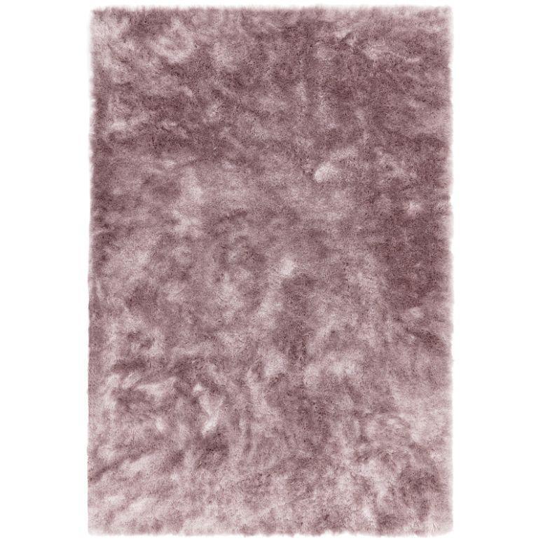 Rectangular pink shaggy rug with fluffy texture and soft pile on white background