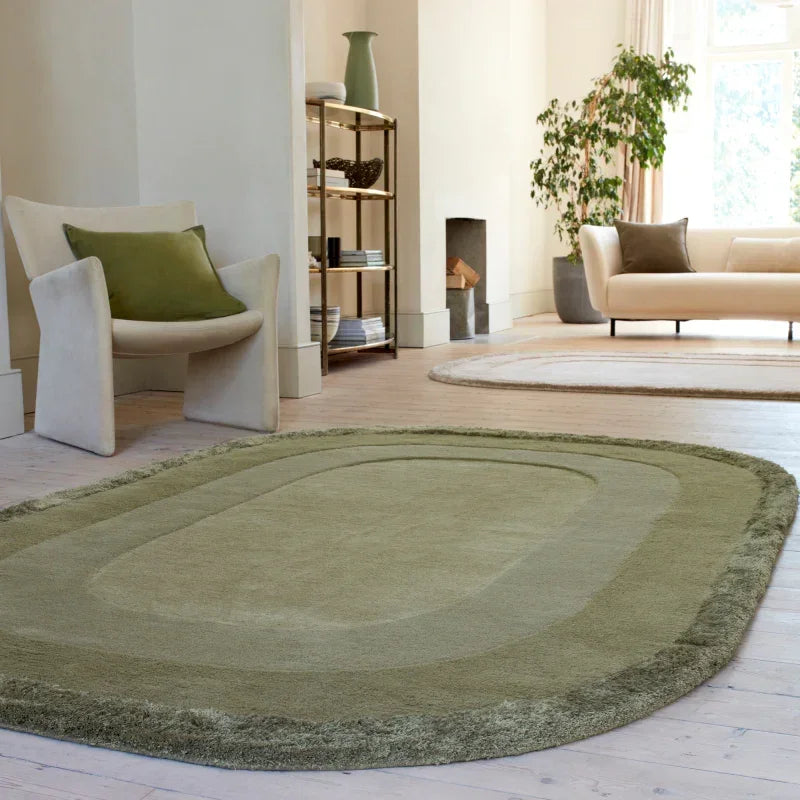 Green area rug with soft texture in modern living room with cream chair and sofa
