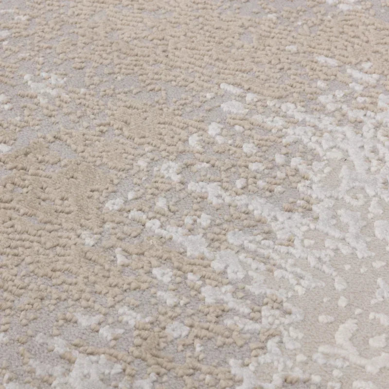 Textured beige and cream area rug detail with soft pile and abstract pattern