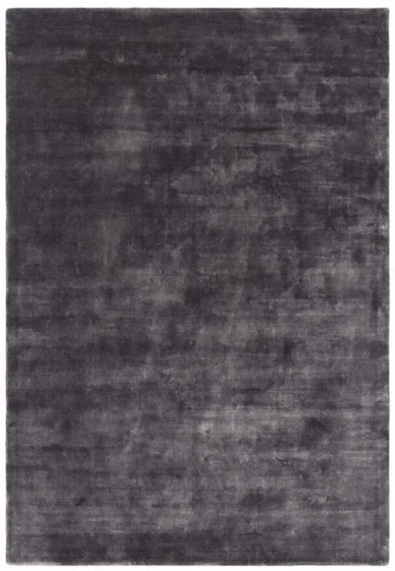 Charcoal grey area rug with a soft velvet texture and subtle tonal shading