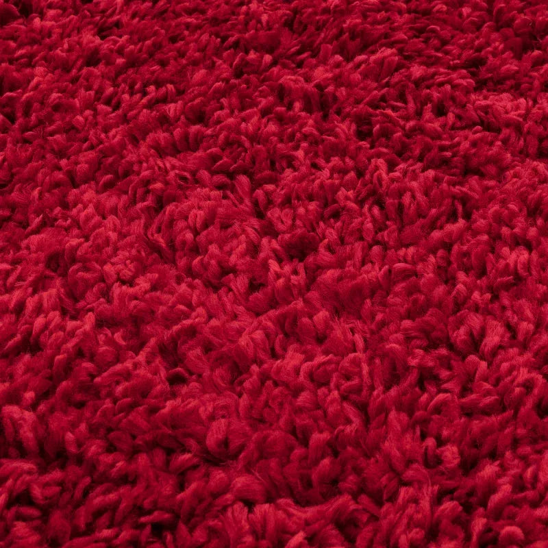 Close-up of red shaggy rug texture and pile
