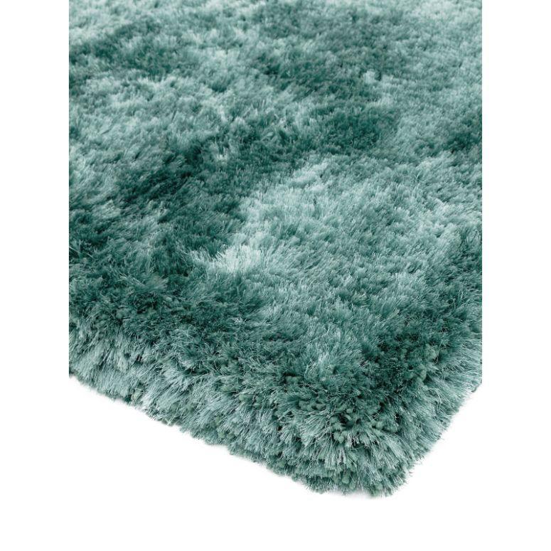 Soft teal shaggy rug close-up showing dense pile and plush texture