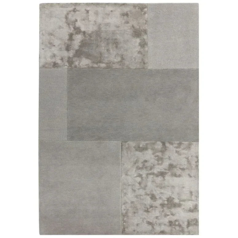 Modern grey area rug with patchwork pattern in textured and smooth sections