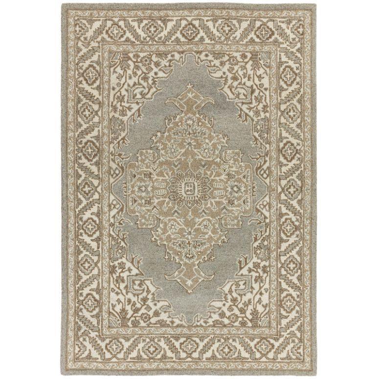 Traditional area rug with beige and grey geometric pattern and decorative border