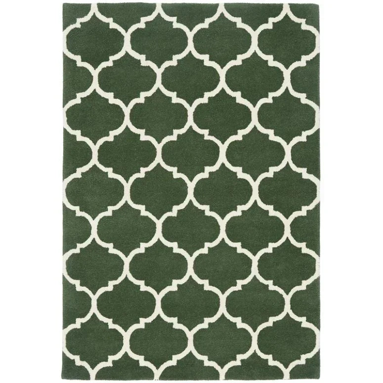 Green area rug with white geometric trellis pattern