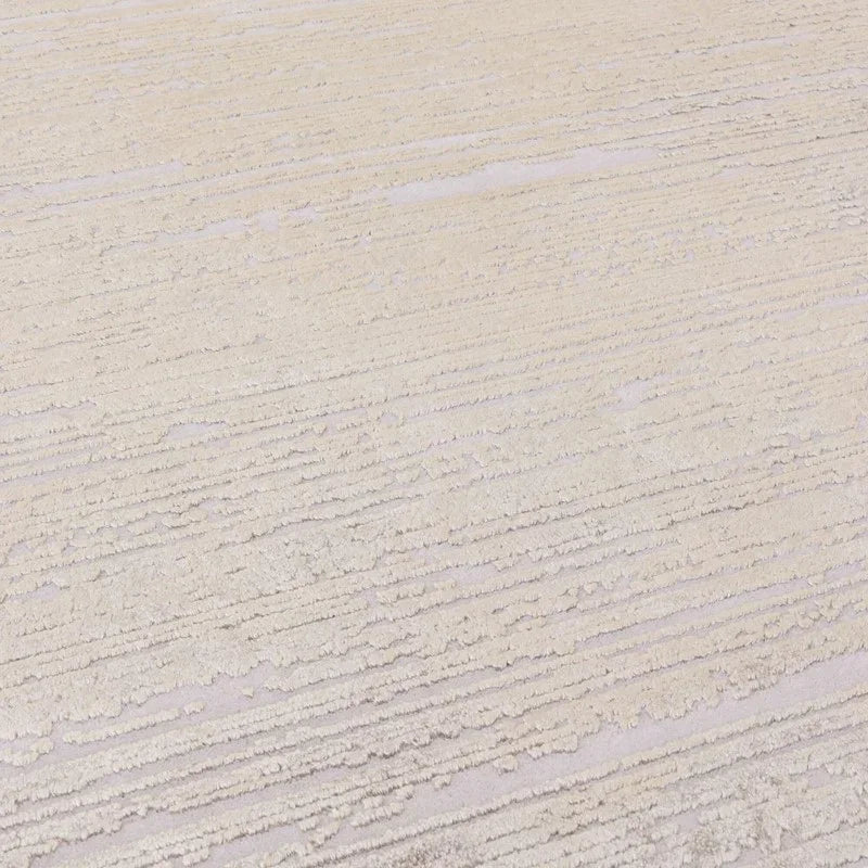 Textured cream rug with raised linear pattern, close-up of modern living room carpet