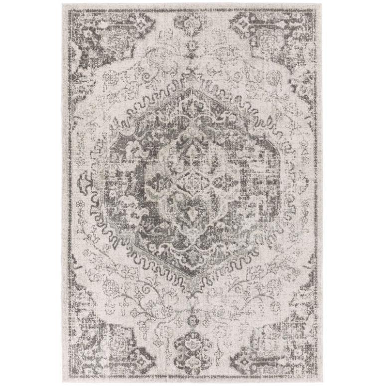 Grey distressed area rug with intricate vintage style pattern and faded detailing