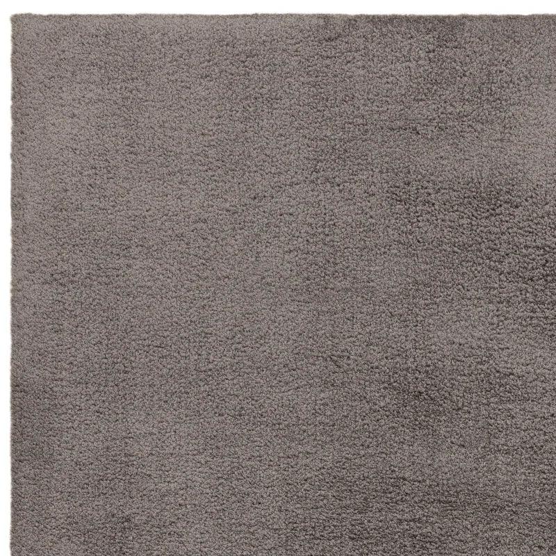 Grey shaggy rug with soft pile corner close-up
