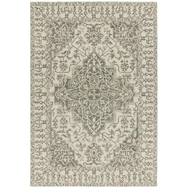 Beige and grey patterned area rug with intricate traditional medallion design