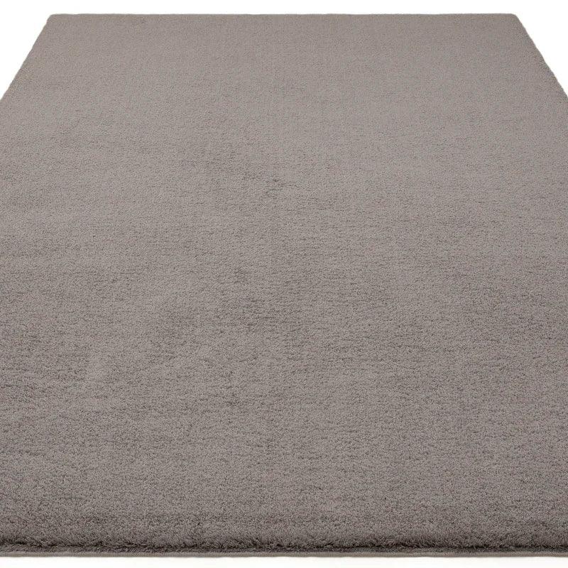 Plain grey area rug with a soft texture and rectangular shape