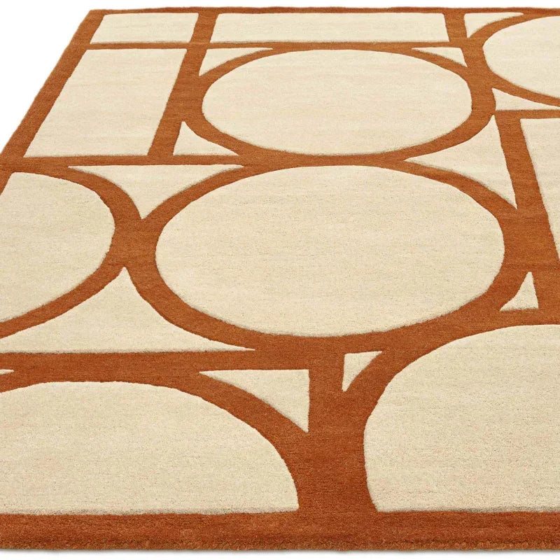 Geometric area rug with cream and rust circles and lines, modern living room decor