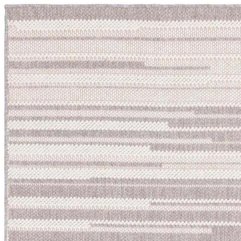 Grey and white woven rug with horizontal stripe pattern and textured surface