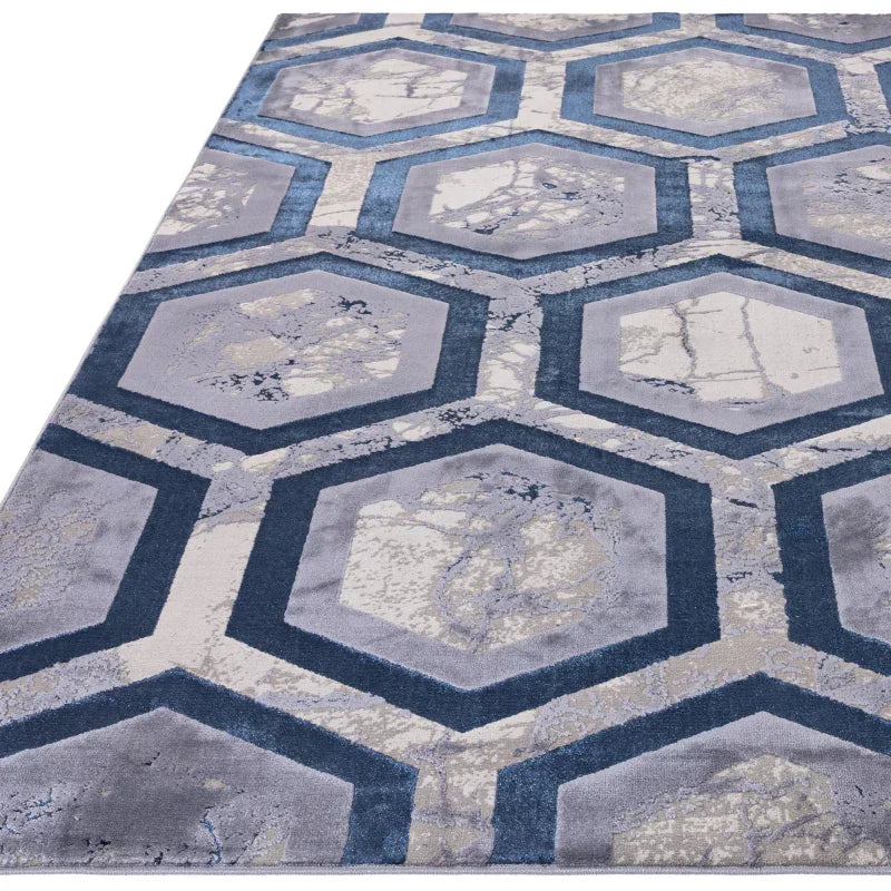 Blue and grey geometric rug with hexagonal pattern and marble effect