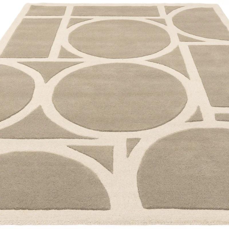 Beige area rug with modern geometric circle and line pattern