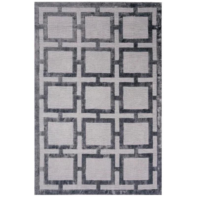 Grey geometric rug with square pattern and dark border, top-down view