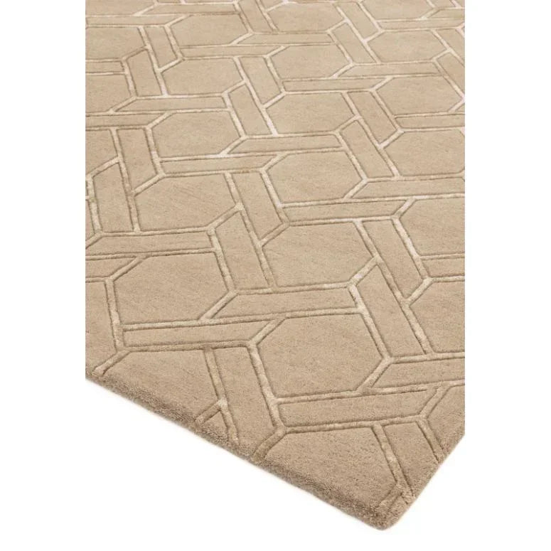 Beige geometric pattern rug with raised texture and angled corner view