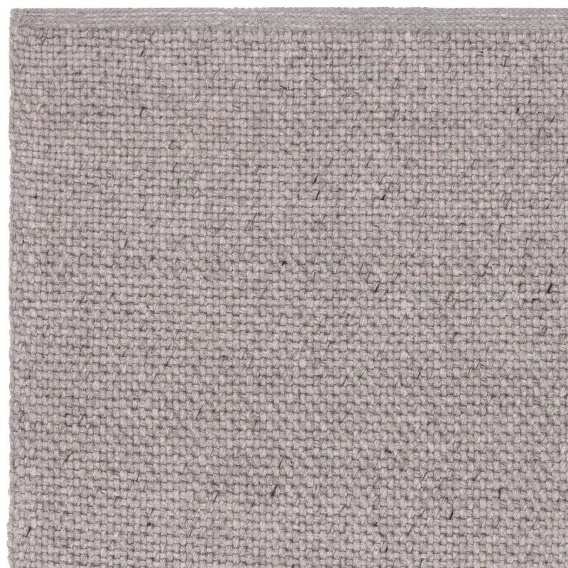 Closeup of grey woven fabric upholstery texture sample