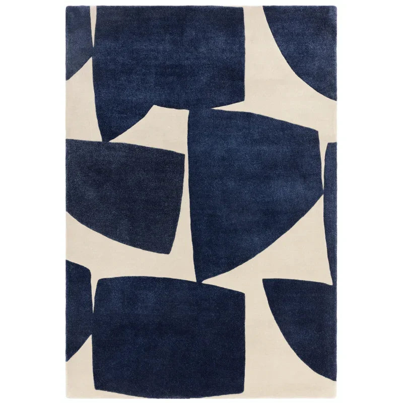 Modern rug with abstract navy blue and cream geometric pattern