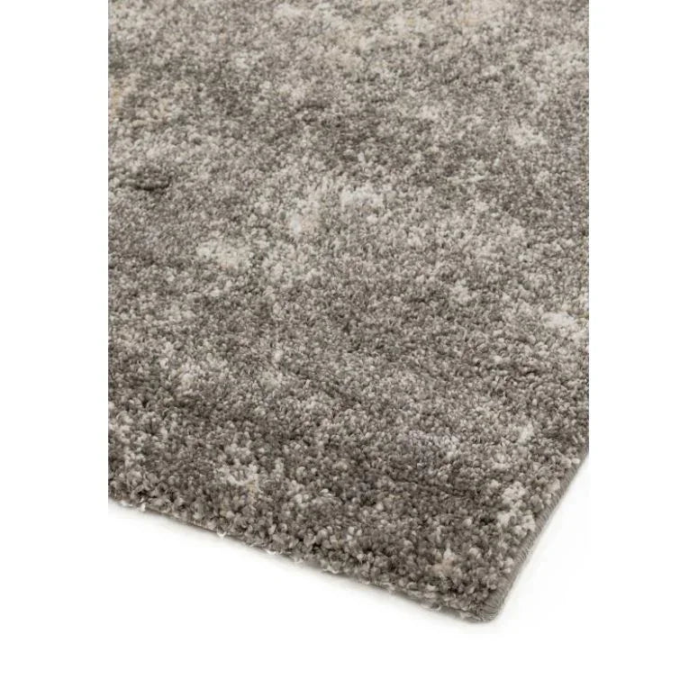 Close-up of grey shaggy area rug with soft pile texture