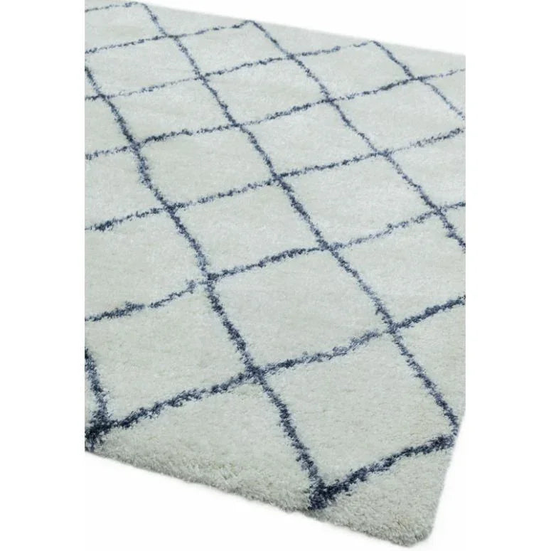 White shaggy rug with black geometric grid pattern, corner angle view