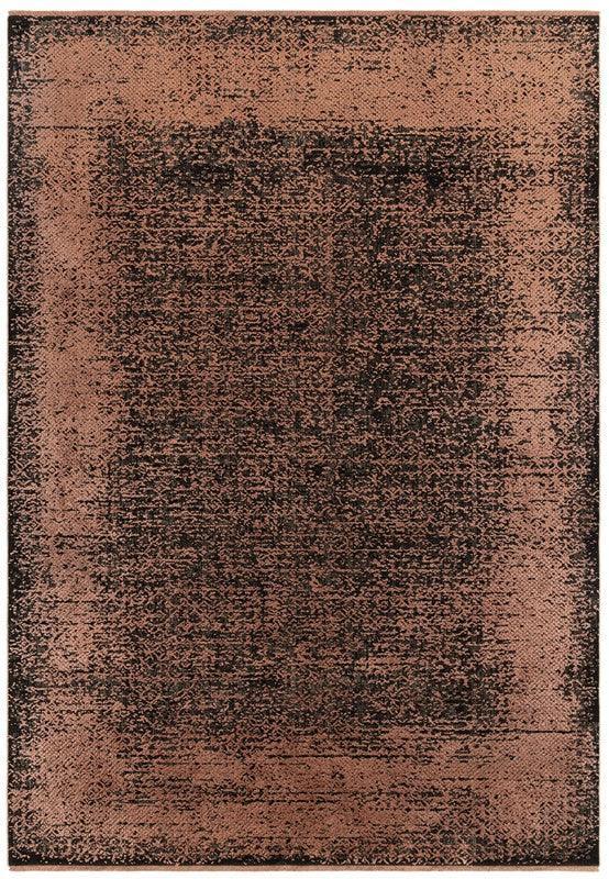 Distressed copper area rug with textured pattern and faded black accents