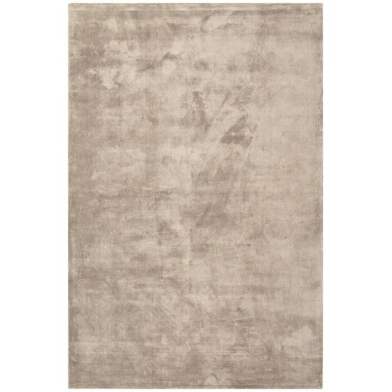 Large rectangular beige area rug with soft textured pile and minimal design
