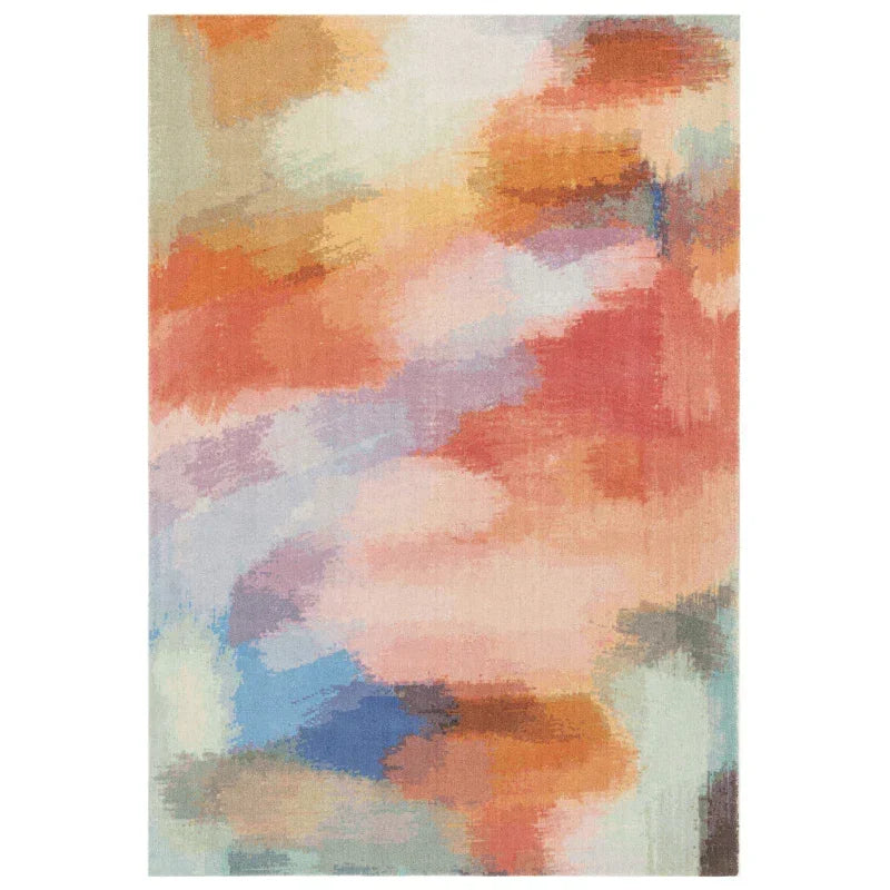 Abstract multicolor area rug with orange, blue, and pastel brushstroke pattern