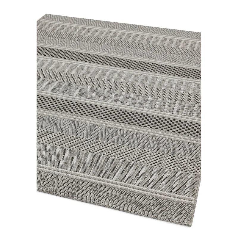 Grey geometric patterned area rug with textured woven stripes