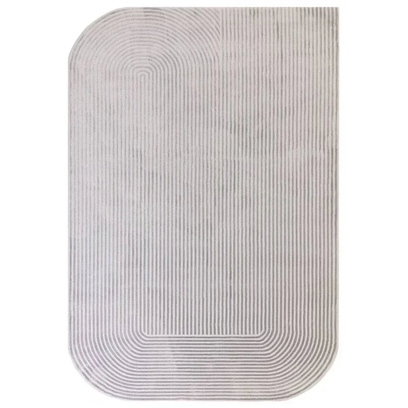 Light grey area rug with rounded corners and linear geometric pattern