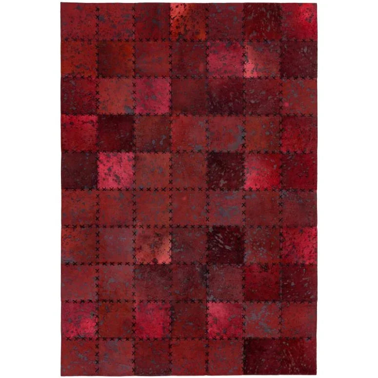 Red patchwork area rug with stitched square pattern and textured finish