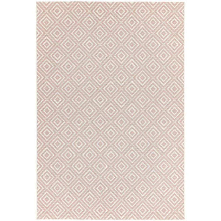 Pink geometric area rug with diamond pattern and textured surface