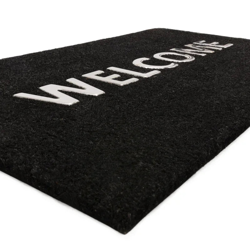 black welcome doormat with bold white lettering, textured surface, angled side view