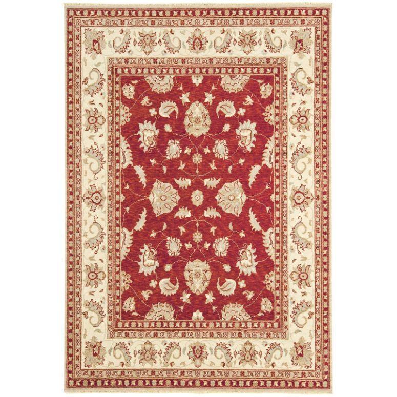 Red oriental rug with cream floral pattern and decorative cream border