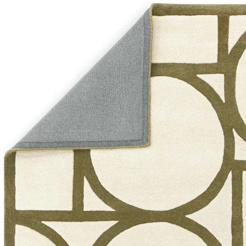 Geometric patterned area rug with cream background and olive green lines, corner folded
