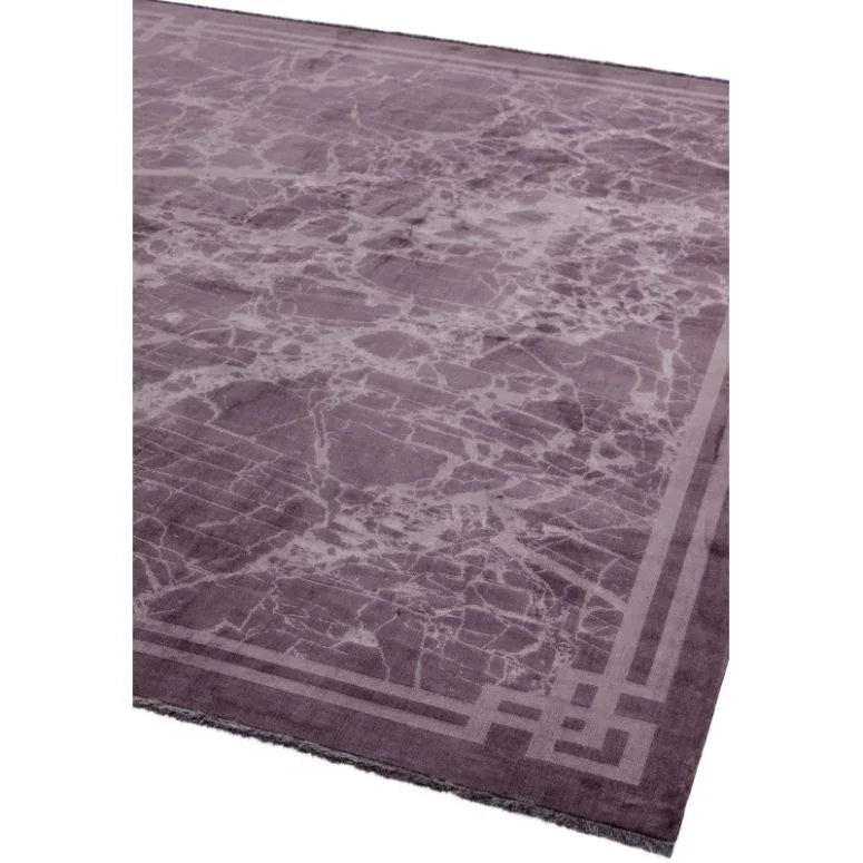 Purple marble pattern rug with geometric border corner view