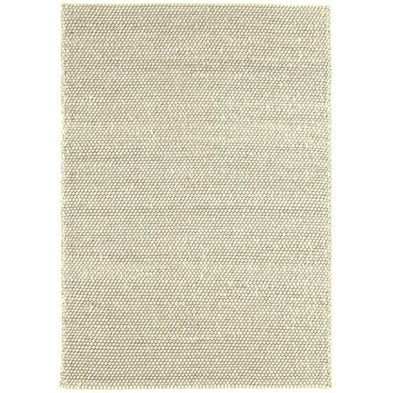 Beige woven rug with textured pattern and straight edges