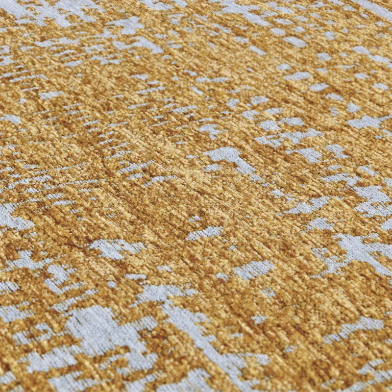 Close-up of gold and grey patterned rug texture