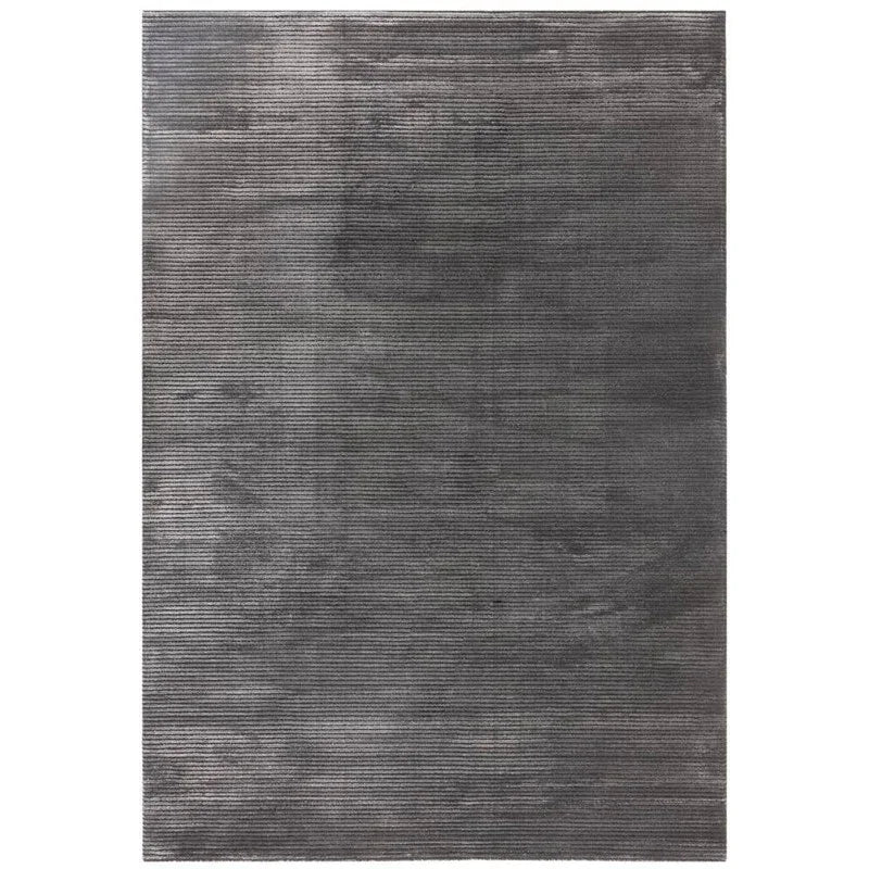 Charcoal grey area rug with subtle linear texture and soft finish