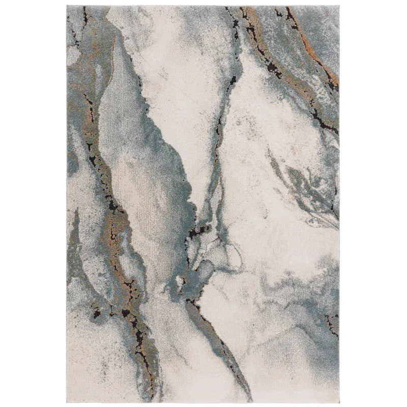 Abstract area rug with blue, beige, and grey marble pattern