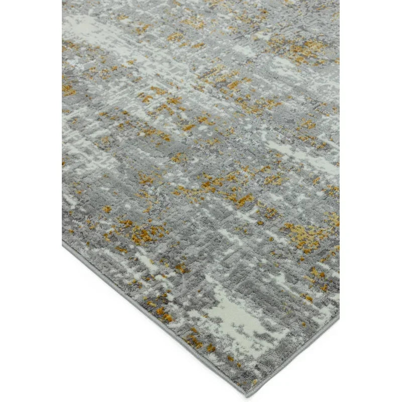 Grey and yellow abstract pattern rug with textured surface and angled corner view