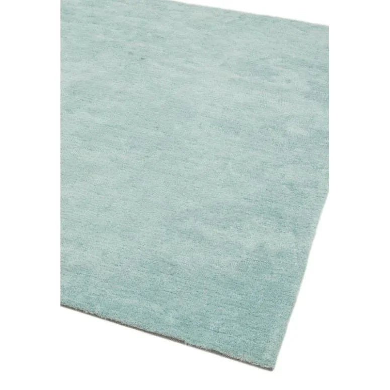Light blue area rug with soft texture and clean corner edge
