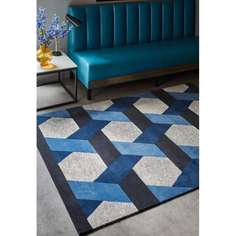 Geometric blue area rug with textured pattern in modern living room setting