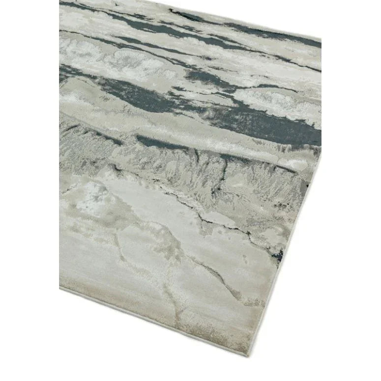 Modern area rug with grey and cream abstract pattern on white background